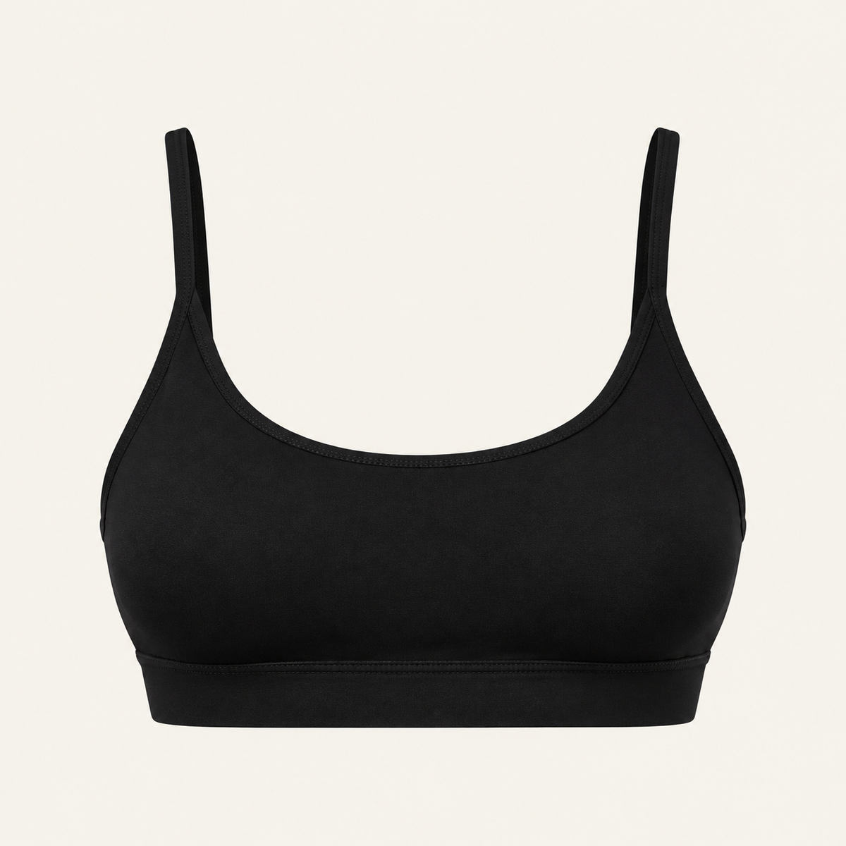 A black scoop-neck bralette with thin shoulder straps and a wide underband, 